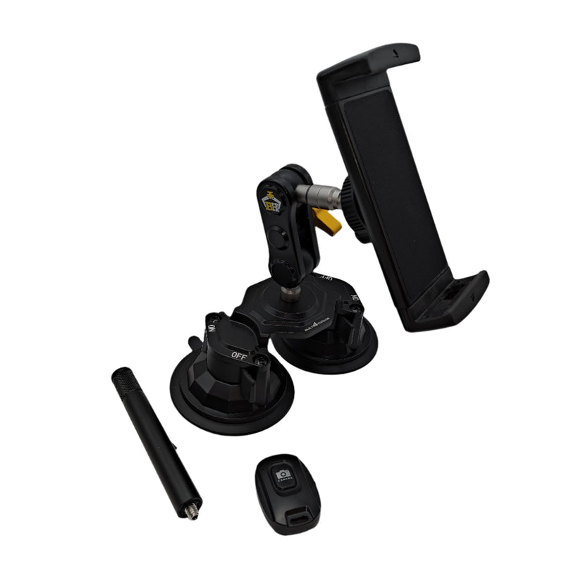 Car phone mount with additional parts on a car interior ceiling.